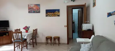 a living room with a table and a couch at ary's house in Rome