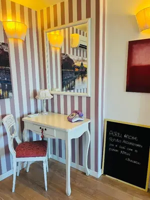 a desk in a room with a window at Cozy Penthouse with Terrace and Rome View in Rome