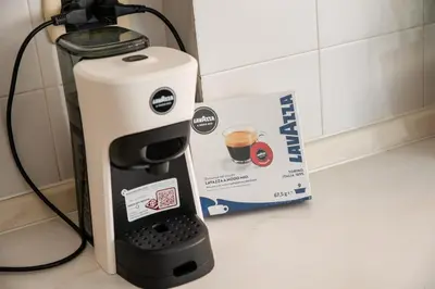 a coffee maker next to a box on a counter at Bernadette Apartment - Vaticano area in Rome