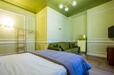 a hallway with white walls and wooden floors at Hold Rome - Luxury Suites in Rome