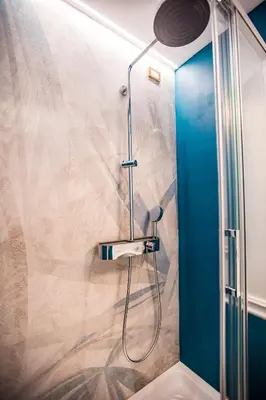 a wooden hanger in a closet at Hold Rome - Luxury Suites in Rome