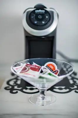a glass bowl on top of a table with a camera at Hold Rome - Luxury Suites in Rome