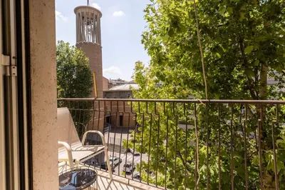a balcony with a view of a tower at La Dolce Vita - Trastevere Station in Rome