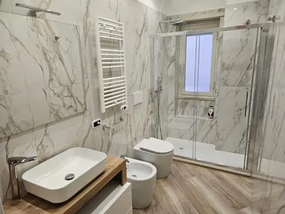 a bathroom with a sink and a toilet and a shower at Mary House in Rome