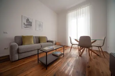 a living room with a couch and a table at Luxury apartment with Vatican views in Rome
