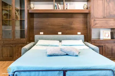 a bedroom with a bed with two pillows on it at Lovely Apartment in Rome - Volturno in Rome