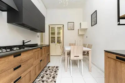 a kitchen with a table and chairs in a room at Comfortable & Cozy by NDP rent in Rome