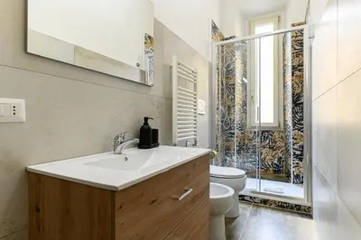a bathroom with a sink and a toilet at Comfortable & Cozy by NDP rent in Rome