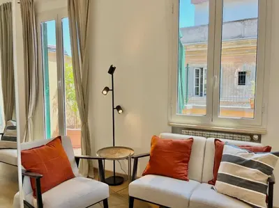 a living room with a couch and a window at Roma San Pietro rooftop view in Rome