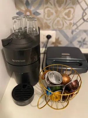 a blender and a basket of glasses on a counter at Dany & Manu House in Rome