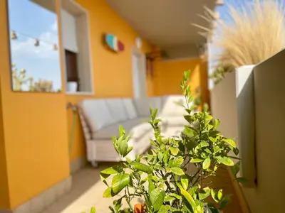 a living room with a couch and a plant at GreenChill House - West Rome in Rome