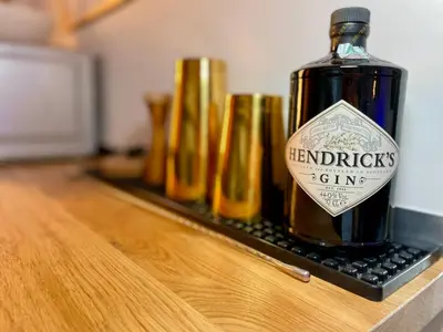 a bottle of herbal picks gin sitting on a counter at GreenChill House - West Rome in Rome