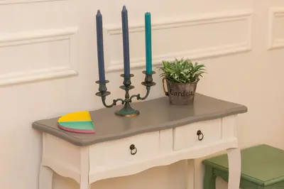 a table with three candles and a plant on it at Boutique Domus Navona Librari in Rome