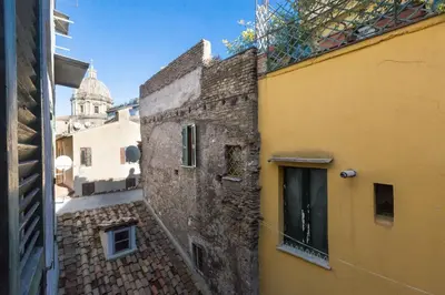 a view from an alley between two buildings at Boutique Domus Navona Librari in Rome
