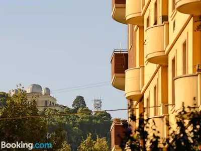 a view of a building with a hill in the background at Casa Volver in Rome