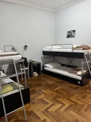 a room with two bunk beds and a wooden floor at Destination In Rome in Rome