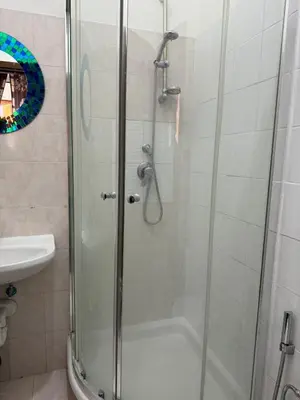 a shower with a glass door in a bathroom at Destination In Rome in Rome