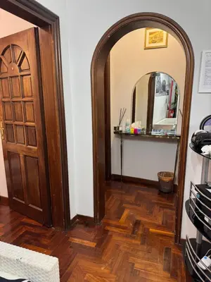 a room with a wooden door and a mirror at Destination In Rome in Rome