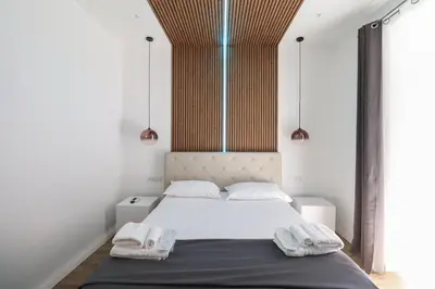 a bedroom with a bed with two towels on it at Essenza House Piazza Fiume in Rome