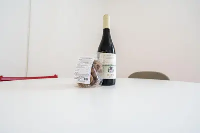 a bottle of wine sitting on a table at Bright and Lovely Apartment in San Lorenzo in Rome