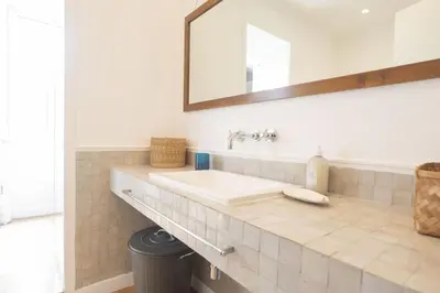 a bathroom with a sink and a mirror at Bright and Lovely Apartment in San Lorenzo in Rome