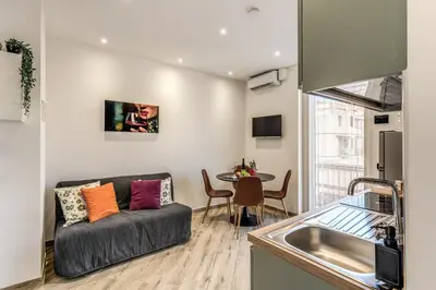 a living room with a couch and a table at Appartamento Roma metro C Greghouse Centocelle in Rome