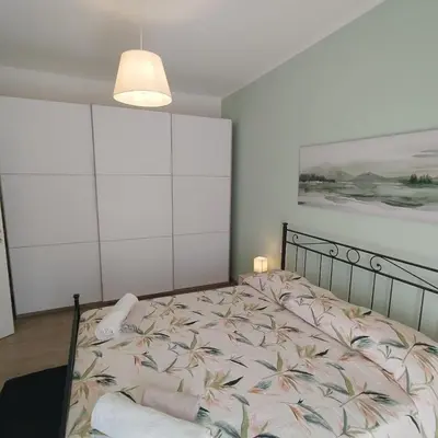 a bedroom with a bed and a painting on the wall at Caravaggio Inn in Rome