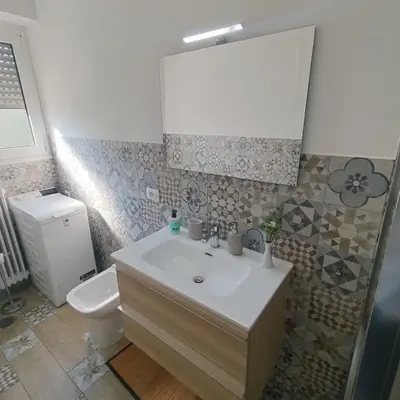 a bathroom with a sink and a toilet at Caravaggio Inn in Rome