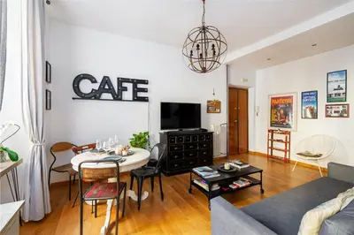 a living room with a couch and a table at Beautiful Apartment Rome Vaticano in Rome