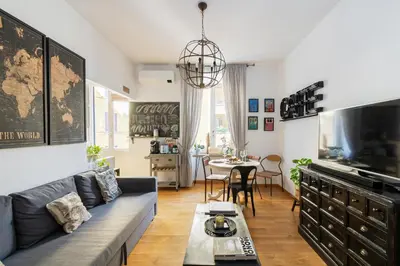 a living room with a couch and a table at Beautiful Apartment Rome Vaticano in Rome