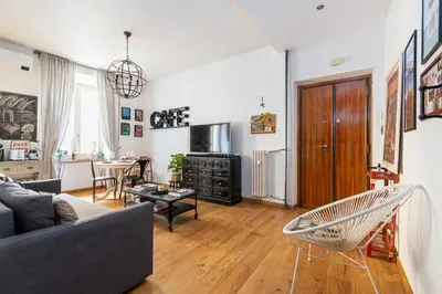 a living room with a couch and a table at Beautiful Apartment Rome Vaticano in Rome