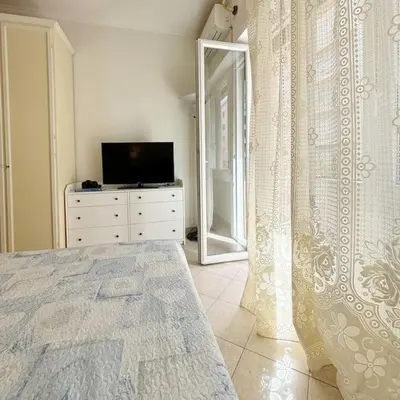 a bedroom with a bed and a dresser with a mirror at PR - appartamento in centro a Roma in Rome