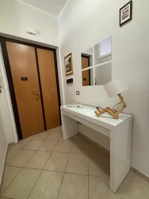 a room with a desk with a lamp and a mirror at PR - appartamento in centro a Roma in Rome