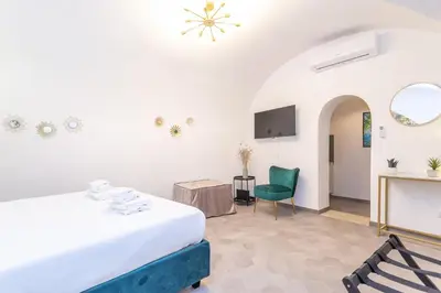 a room with a bed and a table and a chair at Pantheon Giovanni Hideaway in Rome