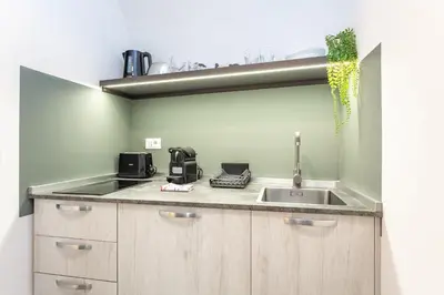 a kitchen with a sink and a counter top at Pantheon Giovanni Hideaway in Rome