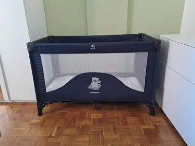 a small blue dog bed in a kitchen at Mauri's Home - CasaMauri - Adiacente Metro C in Rome