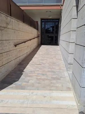 an empty hallway of a building with a door at Mauri's Home - CasaMauri - Adiacente Metro C in Rome