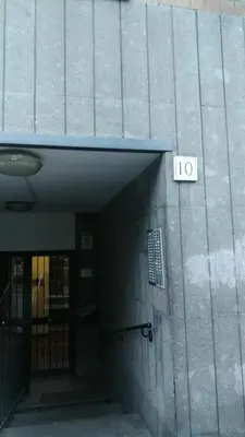 a door to a building with a sign on it at Valle Aurelia House in Rome