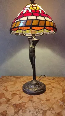 a lamp on a table with a glass lamp on it at Vatican Mamma Roma in Rome