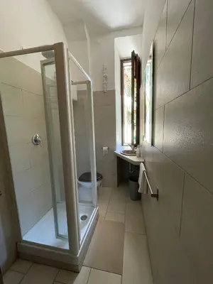 a bathroom with a shower and a toilet and a sink at Vatican Mamma Roma in Rome