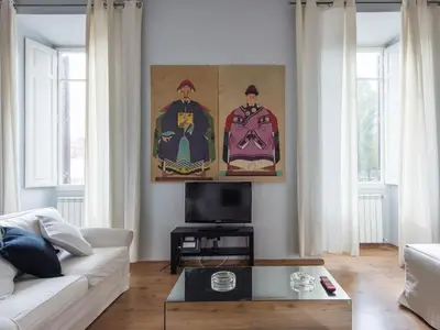 a living room with a couch and a painting on the wall at Apartment La Casa dell'Arte by Interhome in Rome