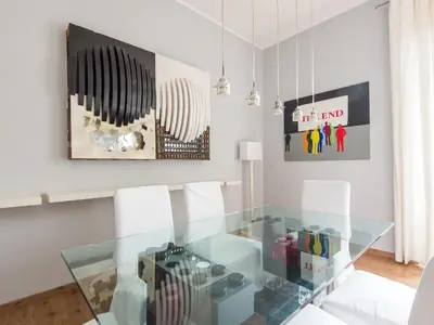 a dining room with a glass table and chairs at Apartment La Casa dell'Arte by Interhome in Rome