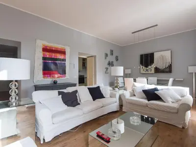 a living room with two white couches and a table at Apartment La Casa dell'Arte by Interhome in Rome