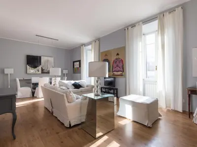a living room with a white couch and a table at Apartment La Casa dell'Arte by Interhome in Rome