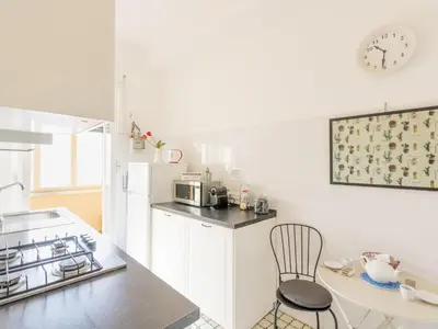 a kitchen with a stove and a counter top at Apartment Appartamento Renato Roma Musei Vaticani by Interhome in Rome