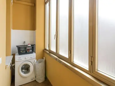 a laundry room with a washing machine and a window at Apartment Appartamento Renato Roma Musei Vaticani by Interhome in Rome