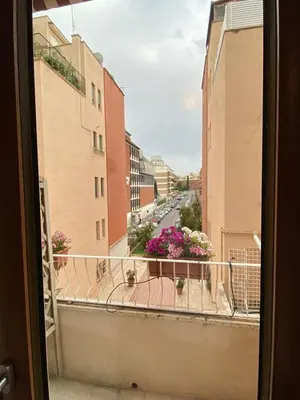 a view of a city street from a balcony at Casa Tua a Roma Centro con box auto tra Stadio Olimpico e Vaticano in Rome