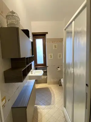 a bathroom with a sink and a toilet and a shower at Casa Tua a Roma Centro con box auto tra Stadio Olimpico e Vaticano in Rome