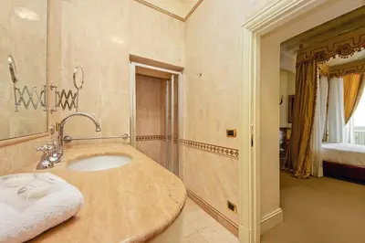 a bathroom with a sink in a room at YCH-Magnifica residenza a Campo de Fiori in Rome