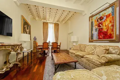 a living room with a couch and a table at YCH-Magnifica residenza a Campo de Fiori in Rome